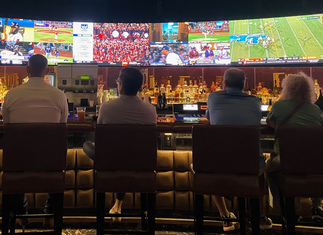 A packed crowd of fans cheering at one of Tokyo's sports bars during a World Cup match