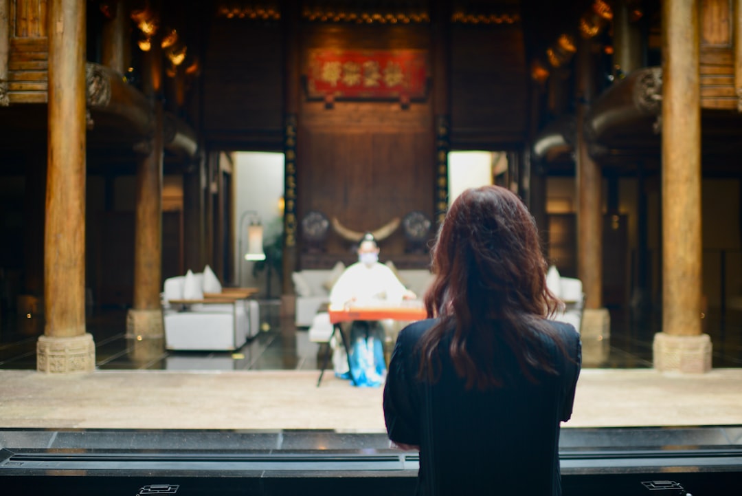A woman in the audience watches a full Kabuki program at the Kabukiza theatre in Ginza, Tokyo