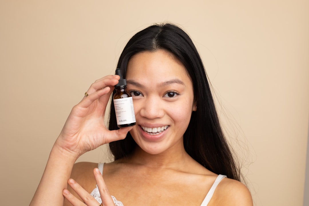A woman applying lightweight serum as part of her humid skin care morning routine in Tokyo