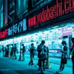 Traders monitor Tokyo stocks during a sharp tech selloff driven by AI profitability fears
