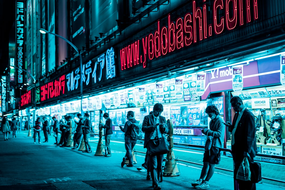Traders monitor Tokyo stocks during a sharp tech selloff driven by AI profitability fears