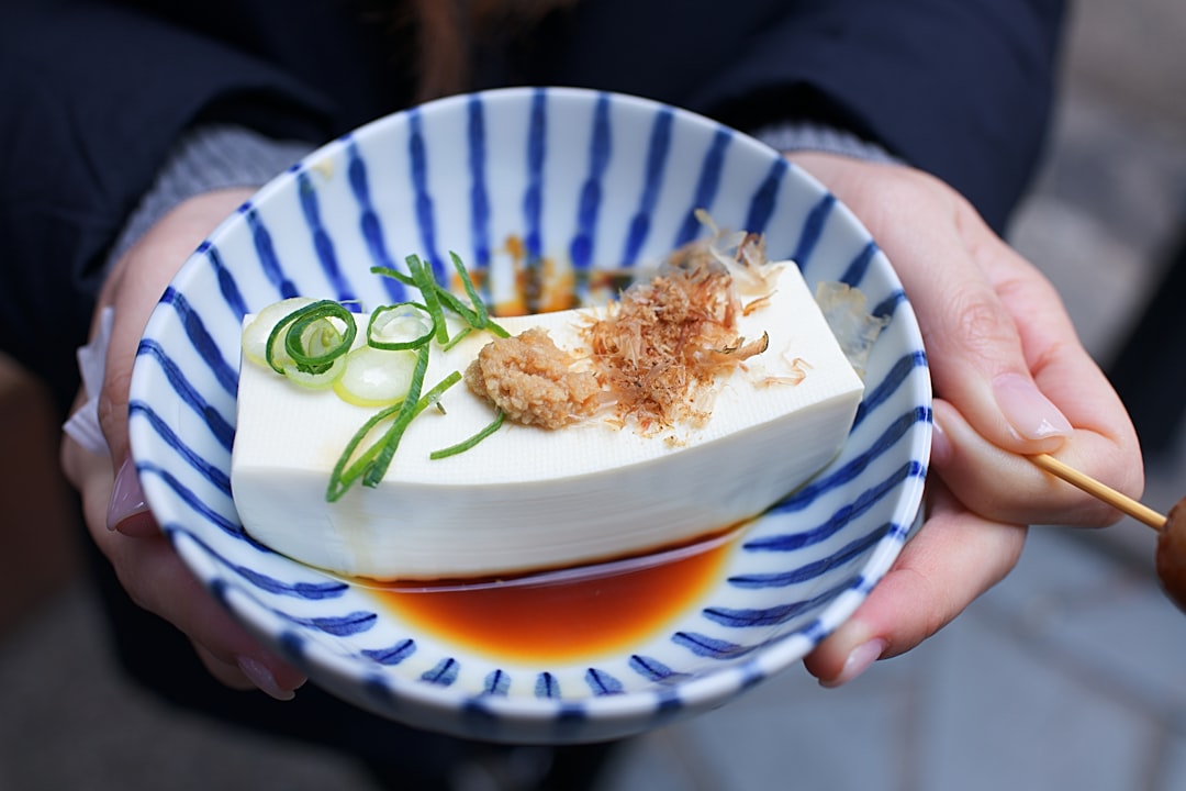 a tray of chilled tofu and cold soba at a traditional Tokyo restaurant, enjoying a slow summer lunch.
