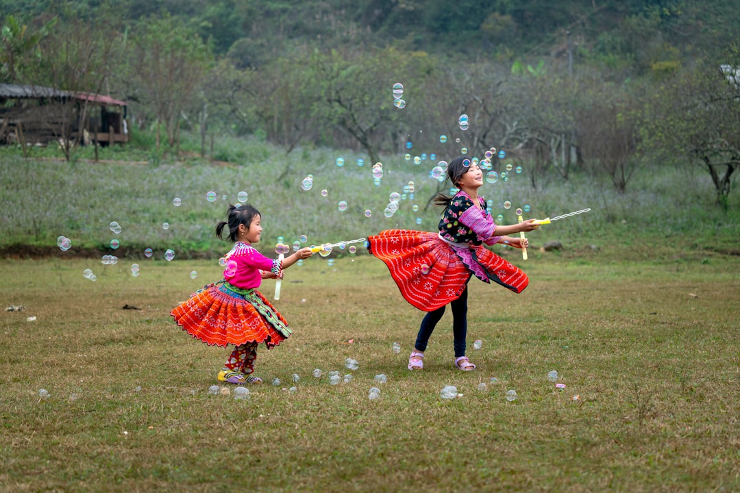 children in yukata join a bon odori circle during Obon week,