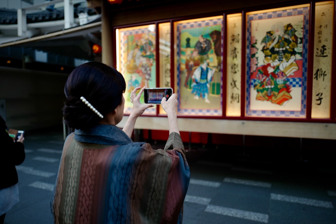 illustration prints displayed on a table at one of the popular art markets in Tokyo on a sunny weekend morning.