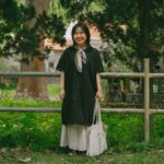 A woman wearing pieces from her capsule wardrobe made of natural-dye Japanese textiles