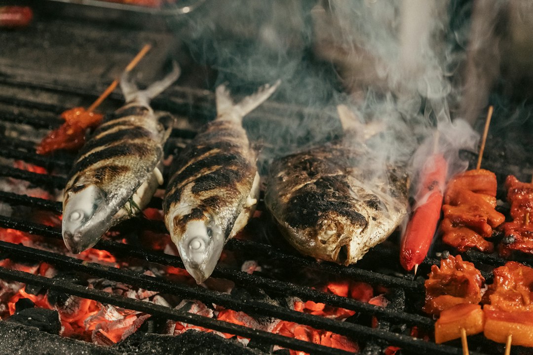 Chef grilling fish during Tokyo's sanma season at an autumn festival